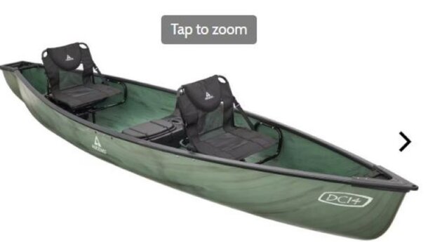 A green canoe with two seats and a paddle, ready for a day on the water.