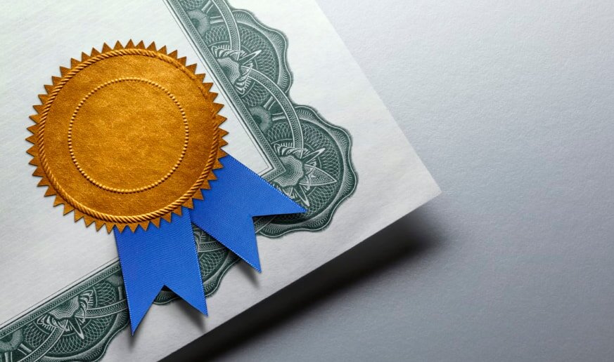 Certificate with gold seal and blue ribbon