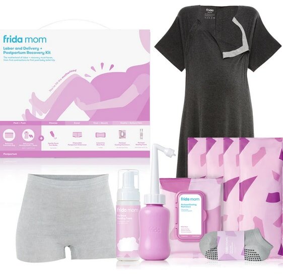Frida Mom postpartum recovery kit with gray gown, pink bottle, wipes, disposable underwear, and socks. Packaging shows a woman holding a baby.