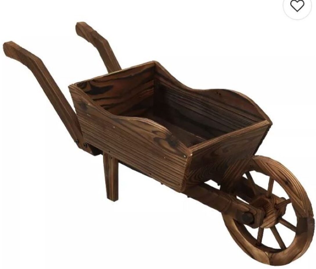 Wooden wheelbarrow with a rustic finish. It has two handles, a single wheel, and a deep tray. Conveys a vintage, handcrafted feel.