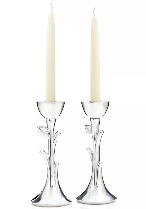Two elegant silver candlesticks adorned with intricate leaf designs.