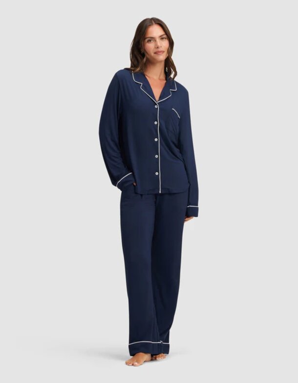 Women's navy pajama set displayed, featuring a comfortable top and matching pants.