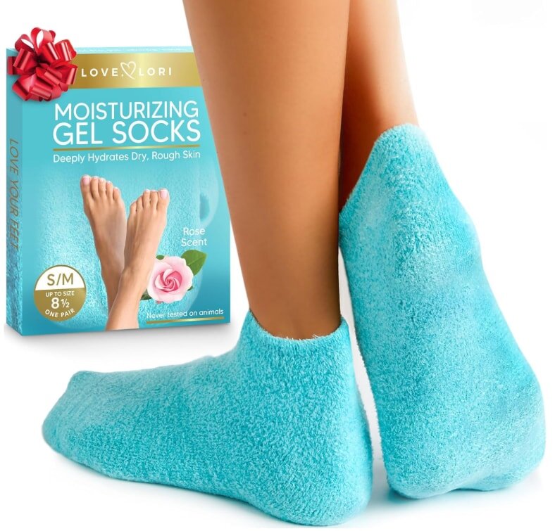 A woman wearing blue socks featuring a foot design, sitting comfortably with her legs crossed.