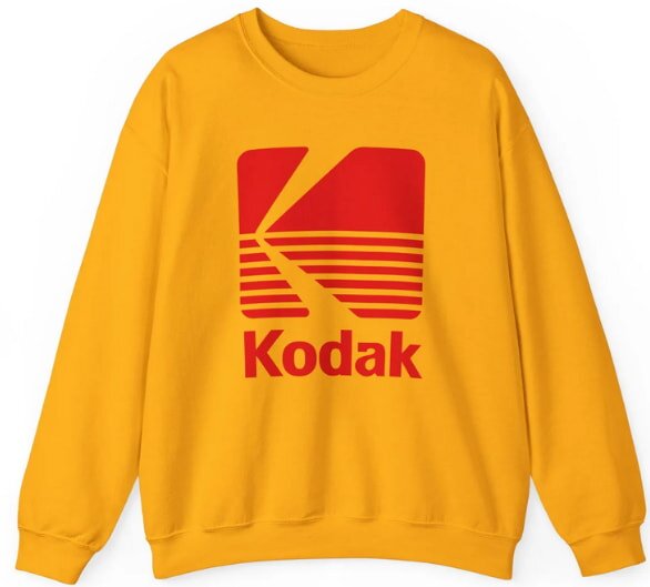 A bright yellow sweatshirt featuring the Kodak logo prominently displayed on the front.