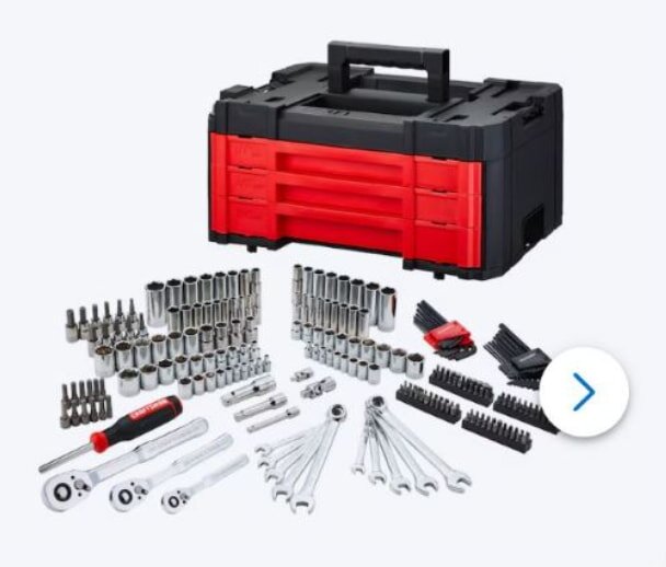 A red and black toolbox with a handle is surrounded by an array of silver sockets, wrenches, ratchets, and screwdriver bits, conveying a well-organized toolset.