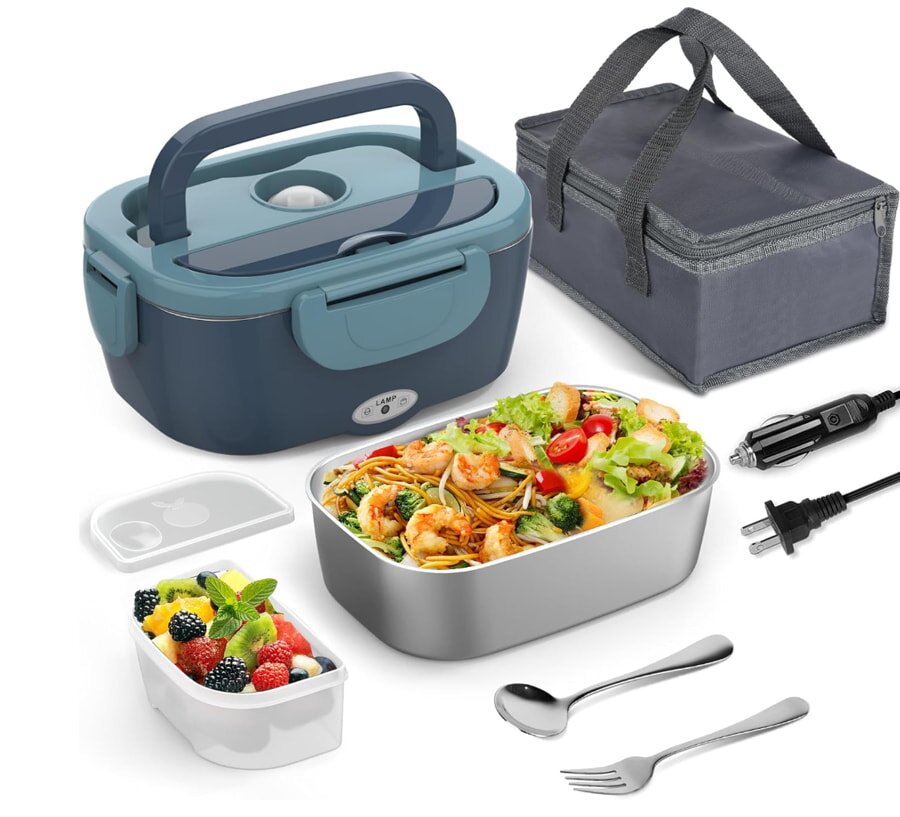 A lunch box containing a fresh salad, a fork, a spoon, and various utensils arranged neatly inside.