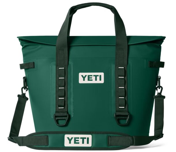 Green Yeti cooler bag displayed against a neutral background, showcasing its durable design and spacious interior.