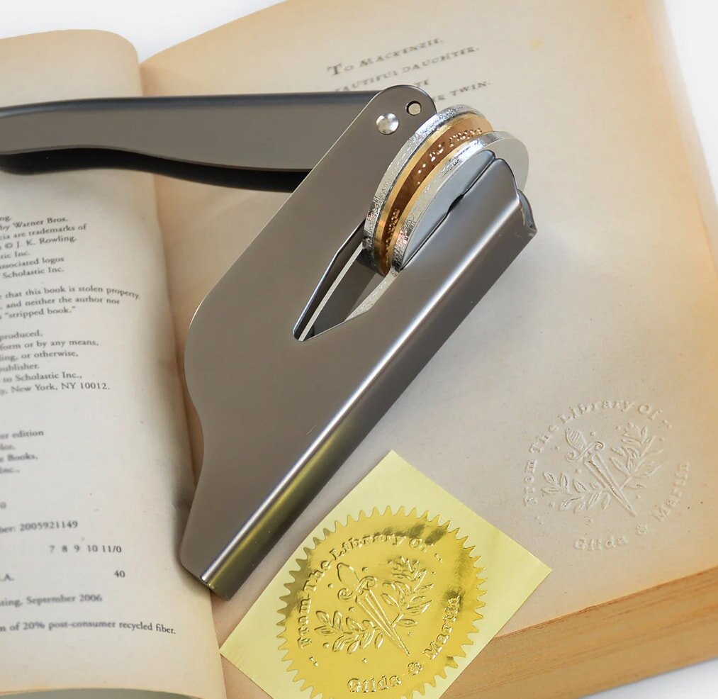 Book stamp and embossed seal on library book