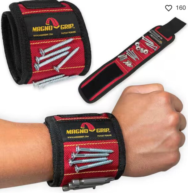 Close-up of a wrist strap featuring a red and black fabric pattern, emphasizing its vibrant colors.