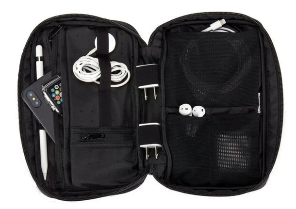 A black case containing headphones, earbuds, and various accessories neatly organized inside.