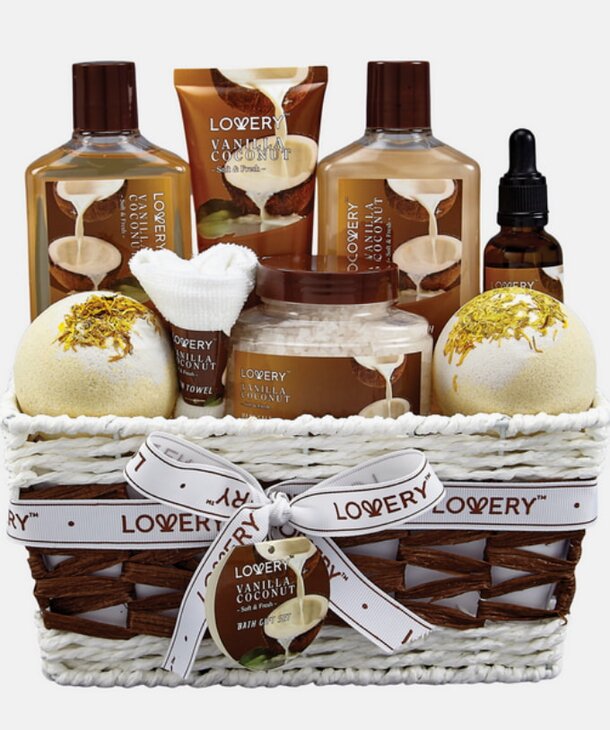 A beautifully arranged bath and body gift basket filled with various skincare products and scented items.