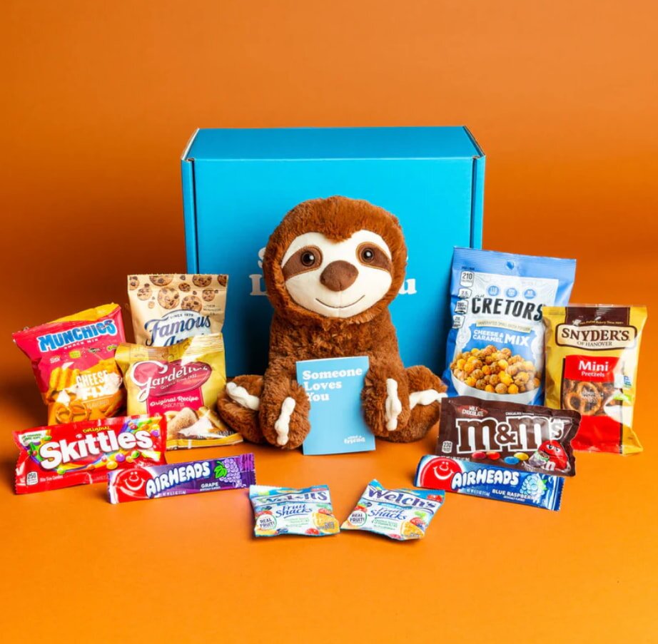 Wooden crate with potted plants, gardening tools, and supplies