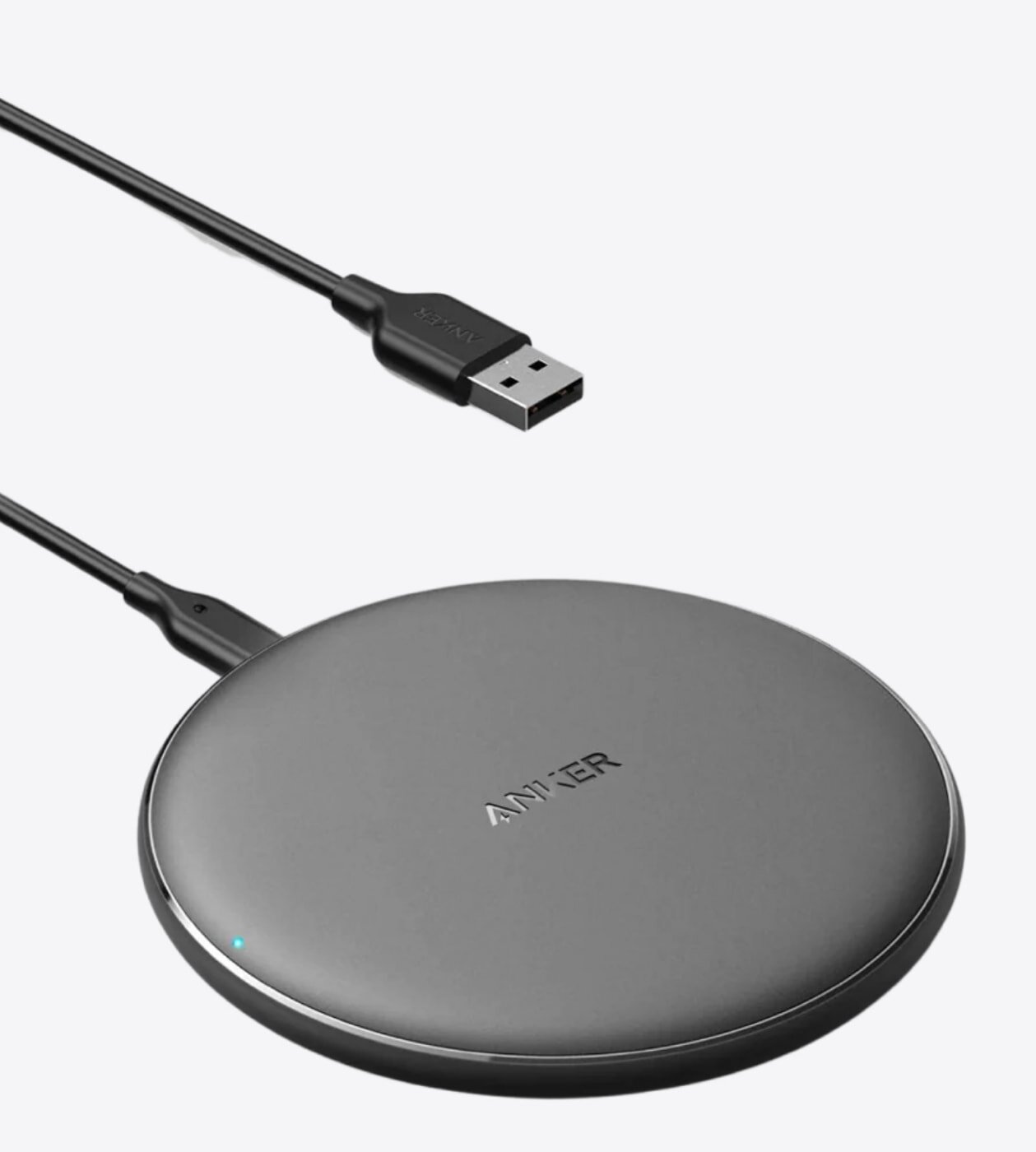 Anker wireless charging pad with a sleek design, suitable for charging compatible devices without cables.