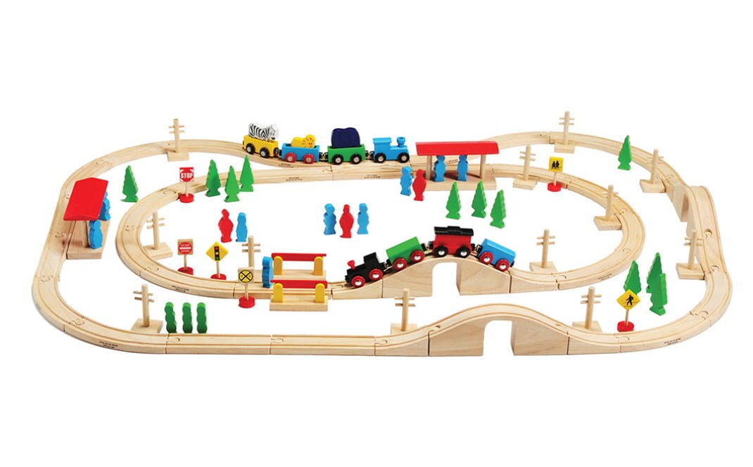 A colorful wooden train set featuring tracks, a train, and small wooden trees arranged on a play surface.