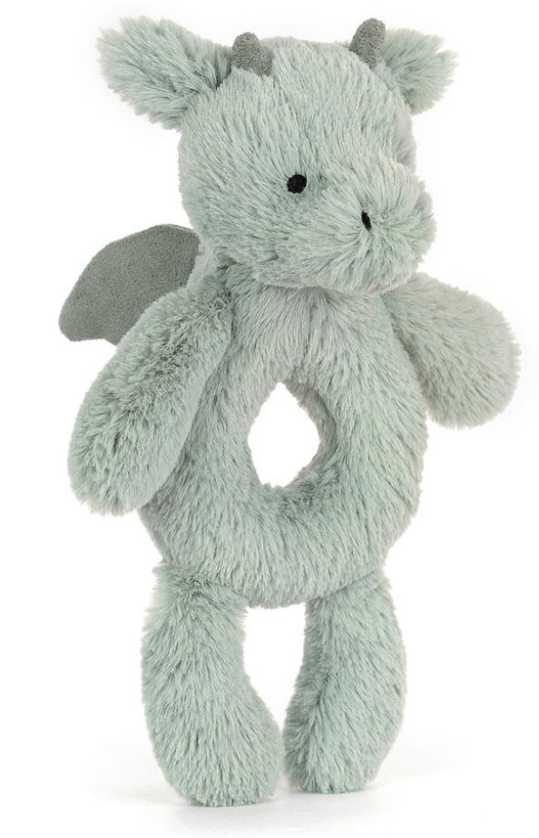 A plush toy featuring a green dragon design, showcasing its vibrant colors and soft texture.