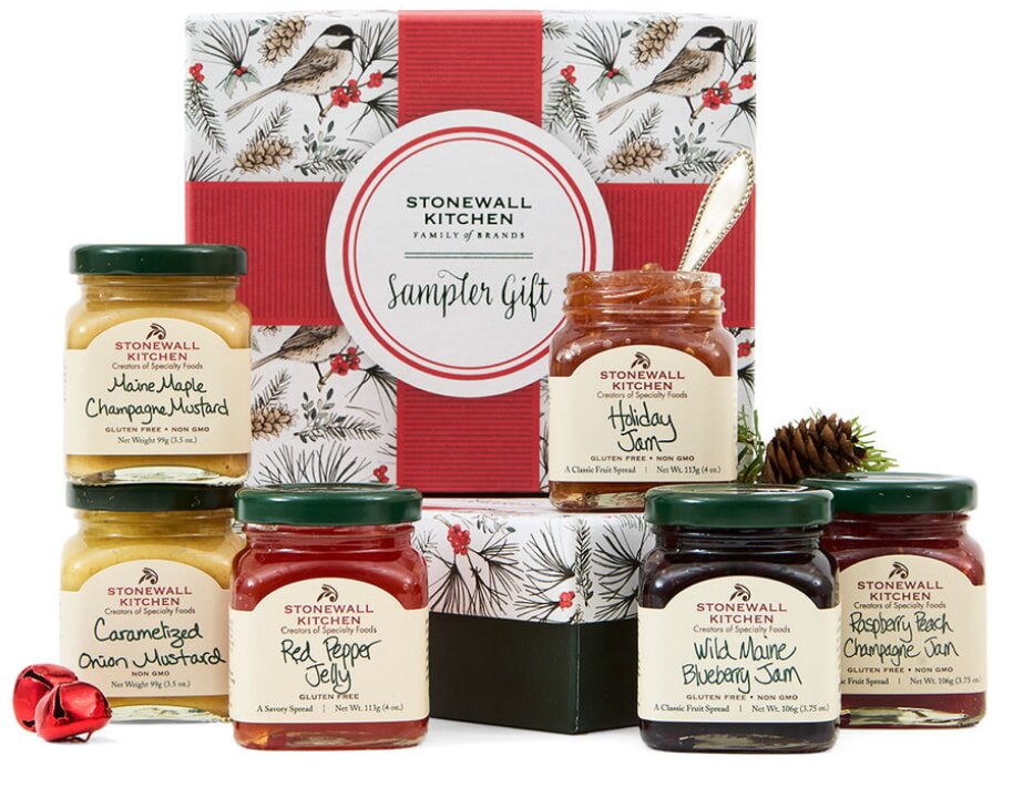 A holiday gift box featuring six assorted jars of jam in various flavors, beautifully arranged for gifting.