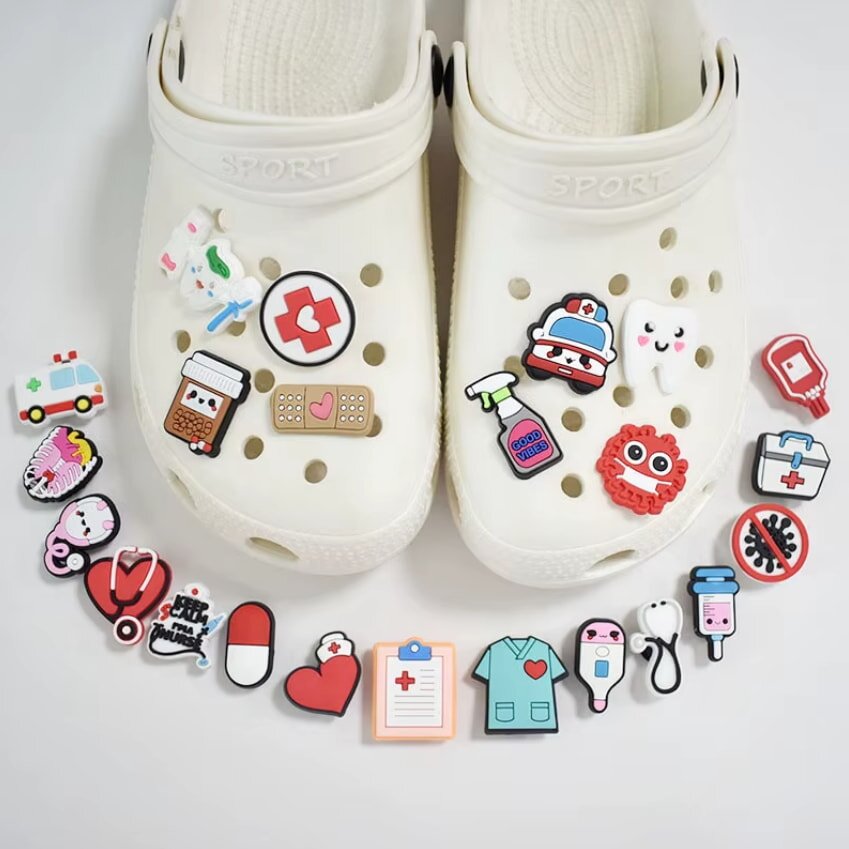White Crocs with medical themed charms