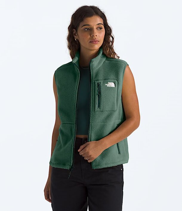 a woman wearing green vest