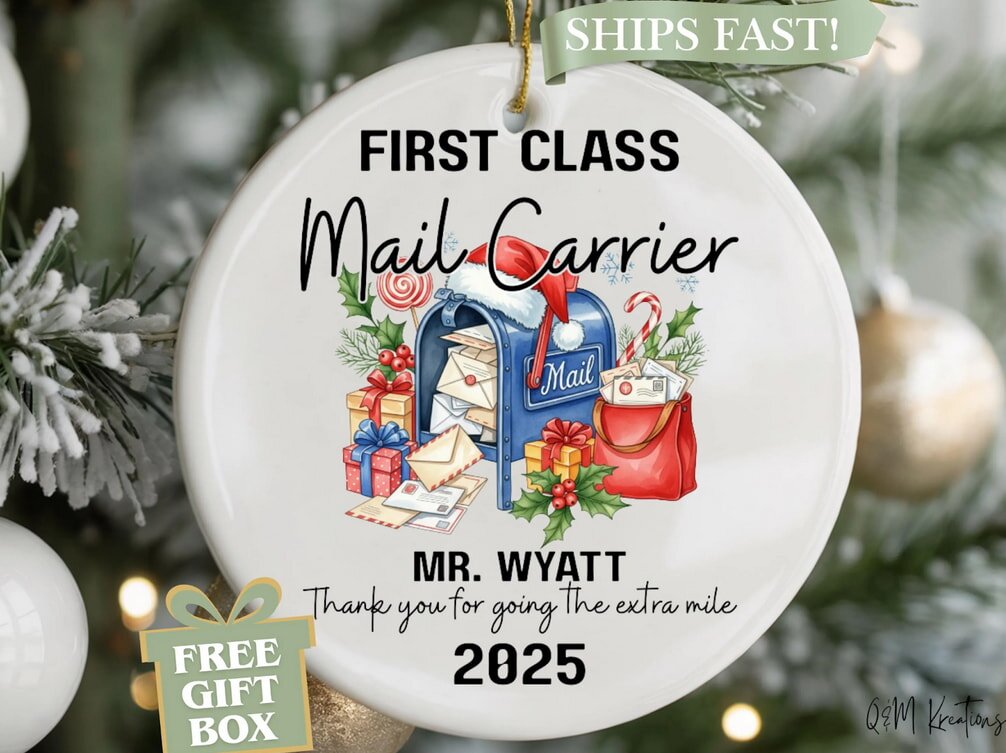 Festive ornament on a Christmas tree reads "First Class Mail Carrier" with a mailbox, gifts, and mail. Text: "Mr. Wyatt, Thank you for going the extra mile, 2025."