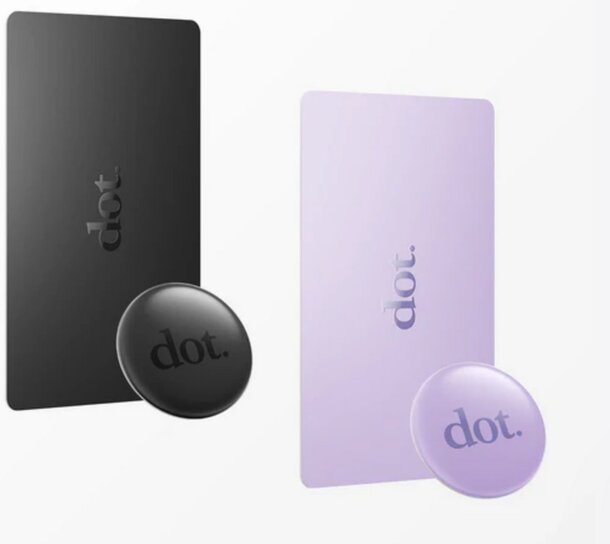 A tiny dot-shaped button, displaying a combination of black and purple colors.