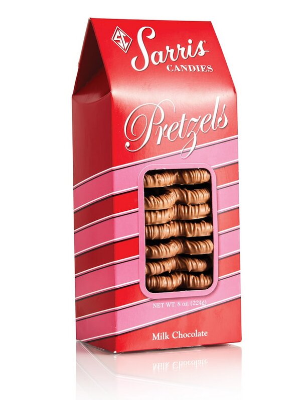 A red and white box filled with assorted pretzels, showcasing their twisted shapes and golden-brown color.