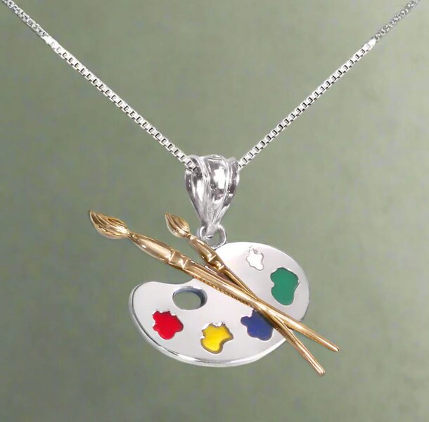 A vibrant palette and paintbrush pendant are featured on a stylish necklace, showcasing artistic flair and creativity.