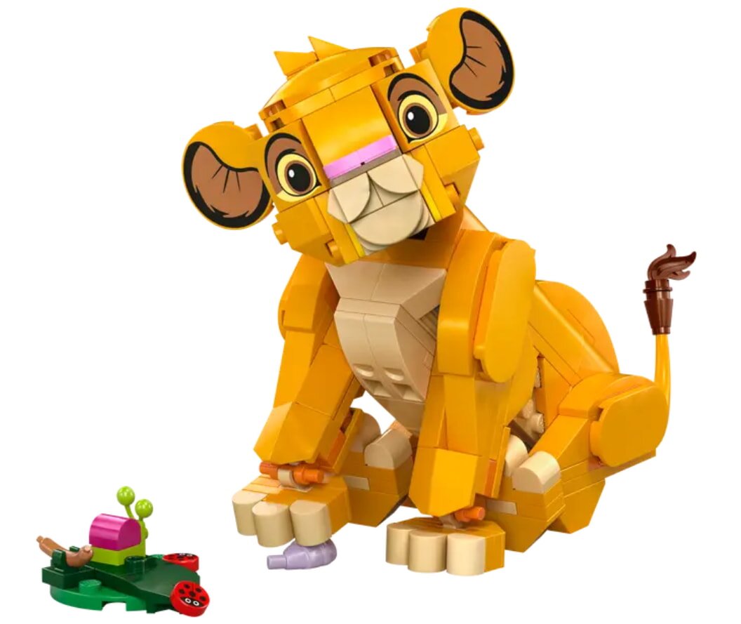 A LEGO lion sits on the ground beside a colorful toy, showcasing a playful scene.