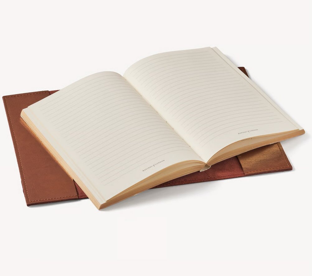 Black t-shirt on hanger with colorful "Activity Director" text, surrounded by words like "compassionate" and "fun," conveying positivity and dedication.