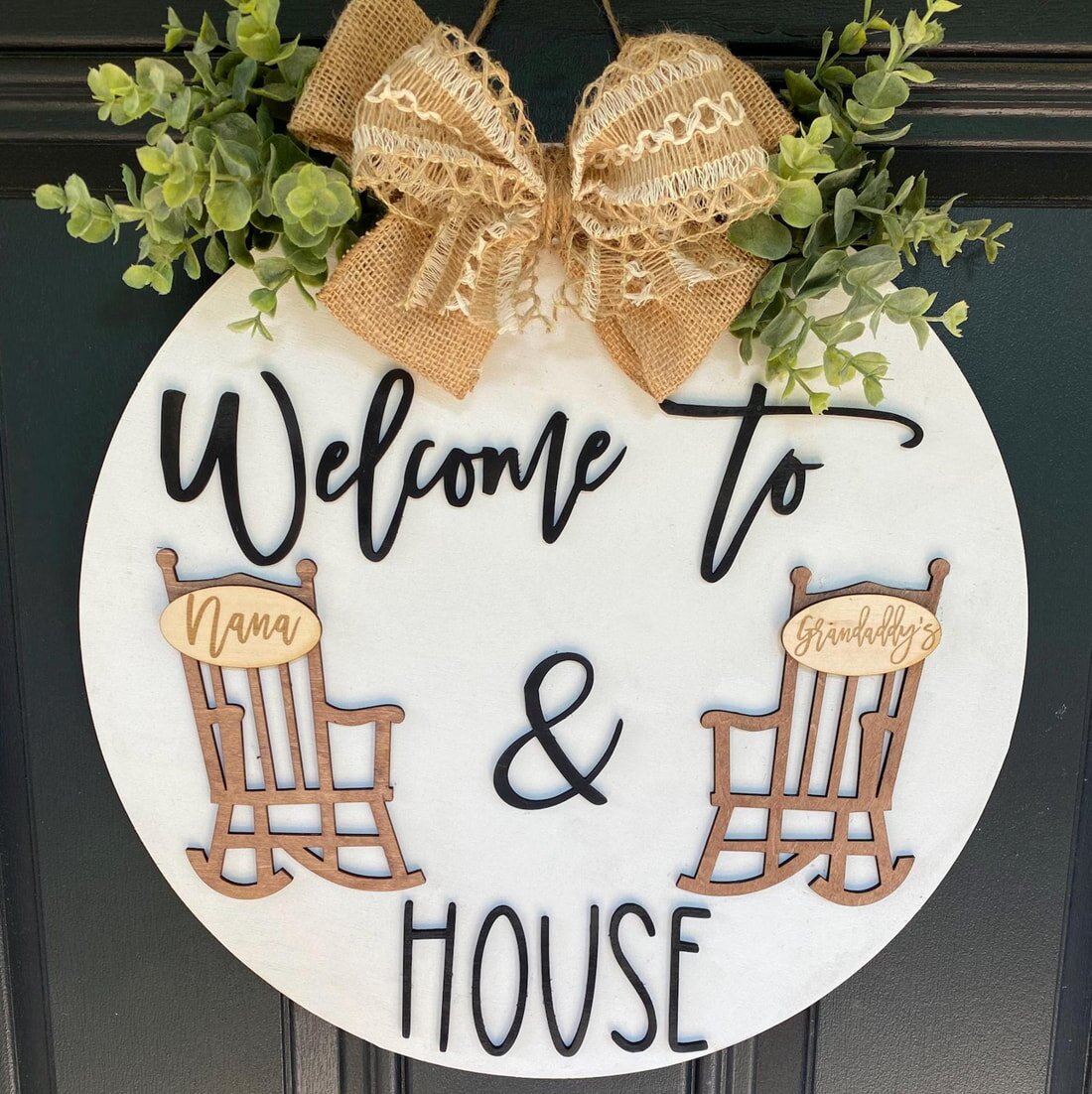 A decorative door hanger with the text "Welcome" displayed prominently, inviting guests to enter the home.