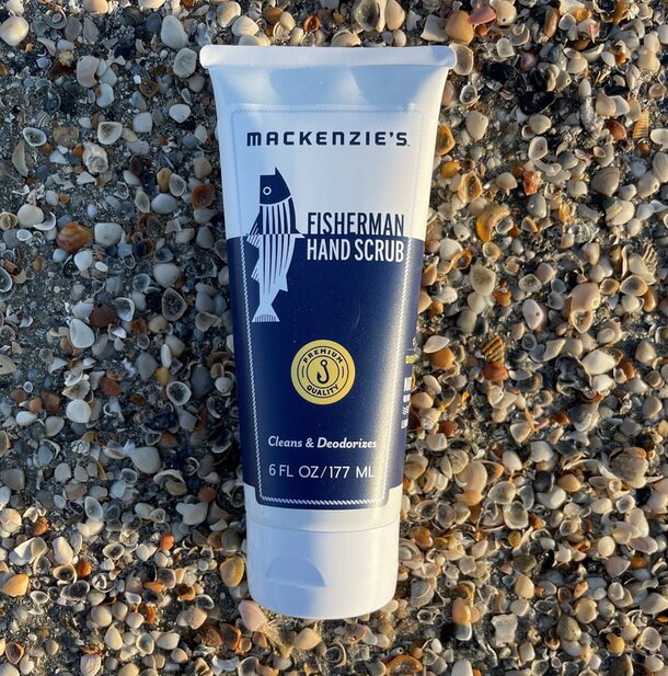 A tube of hand soap placed on a textured rock surface, highlighting its natural surroundings.