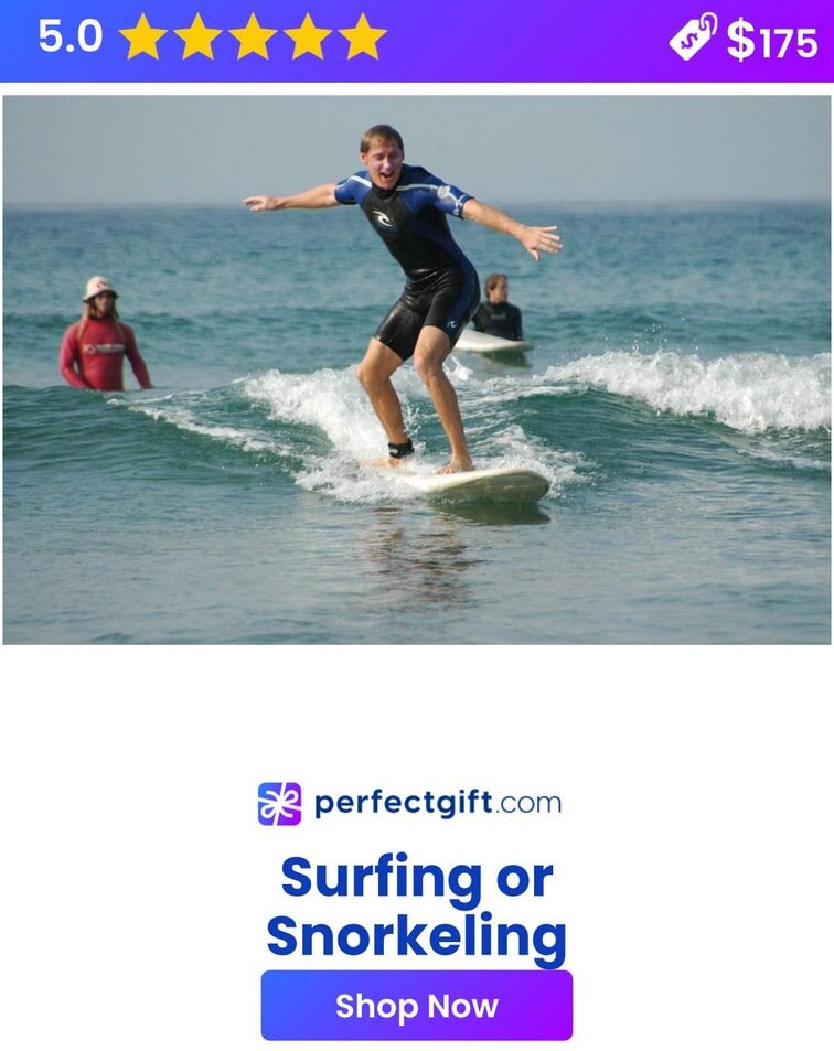 Man surfing a small wave, smiling under a sunny sky. PerfectGift.com offers surfing or snorkeling experiences. Shop now.