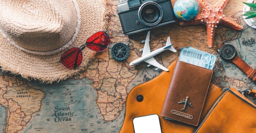 Travel accessories on a world map