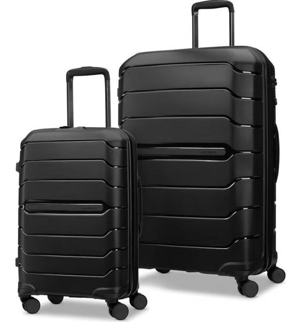 Two black wheeled luggage pieces on a white background, showcasing a sleek and modern design.
