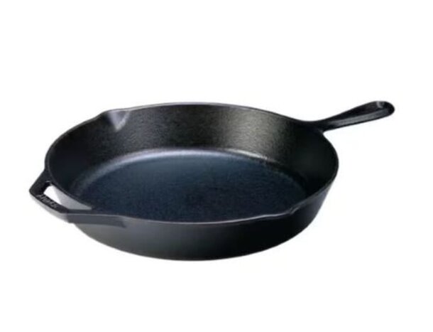 A black cast iron skillet resting on a clean white background, showcasing its smooth surface and sturdy handle.