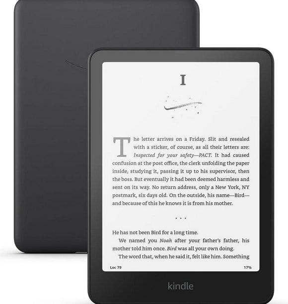 Kindle device displaying text on its screen, with a black cover in the background. The text is from a book's page.