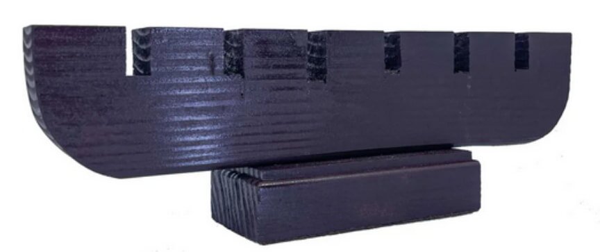 A black wooden menorah displayed against a clean white background, highlighting its elegant design.