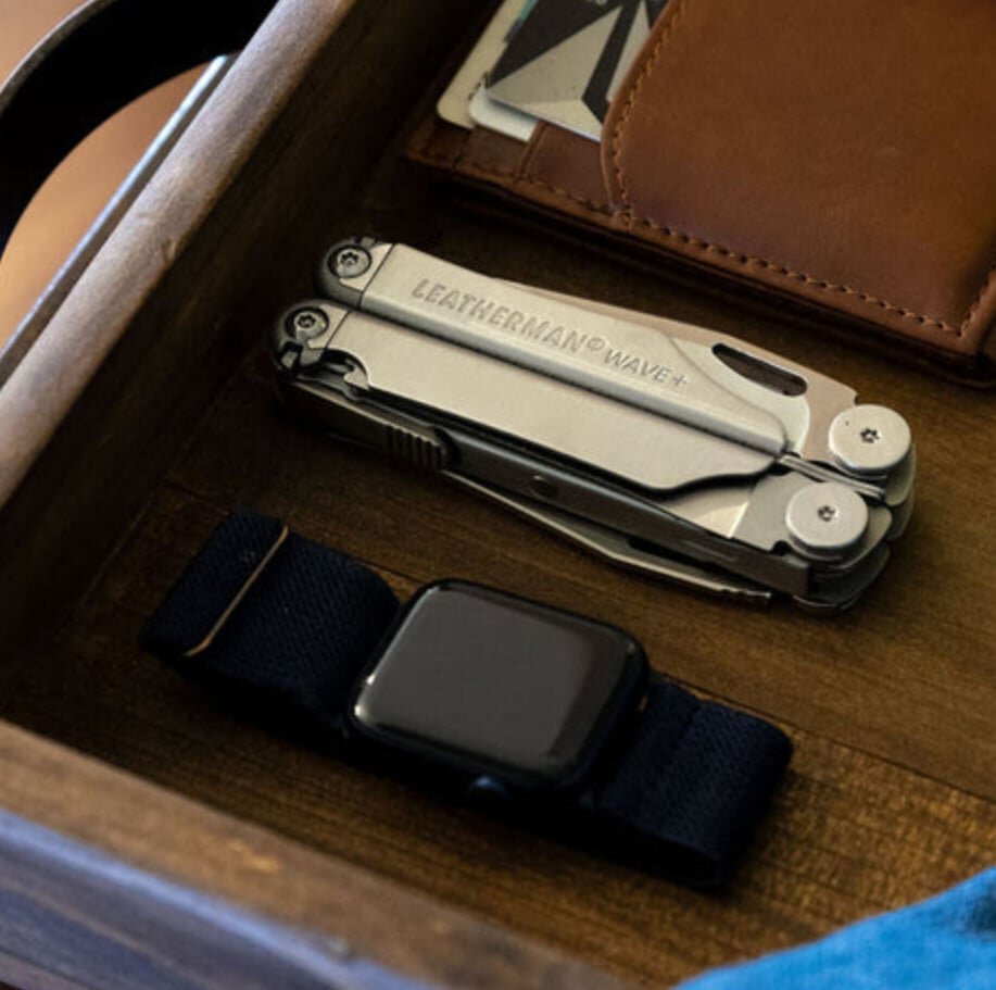Leatherman Wave+ multi-tool opened to show its pliers, knives, and saw.