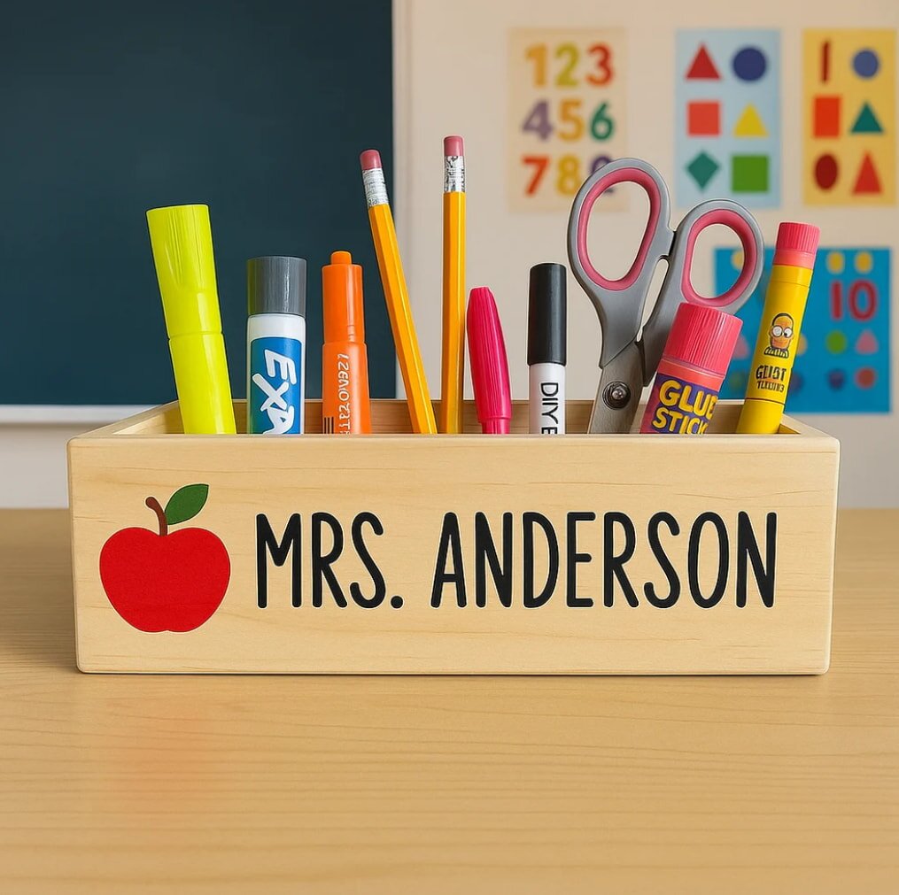 Teacher's desk with wooden pencil box labeled MRS. ANDERSON