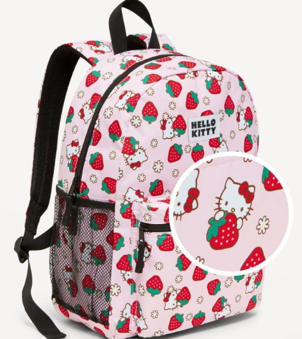 A Hello Kitty backpack featuring a playful strawberry print, perfect for children and fans of the iconic character.