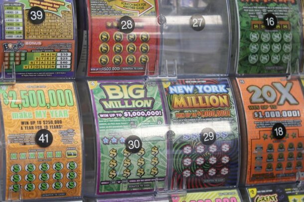 A large display of colorful lottery tickets arranged neatly in a store, showcasing various game options for customers.