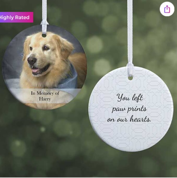 Ceramic ornaments with white ribbons. Left: Golden retriever photo with "In Memory of Harry." Right: "You left paw prints on our hearts" text.