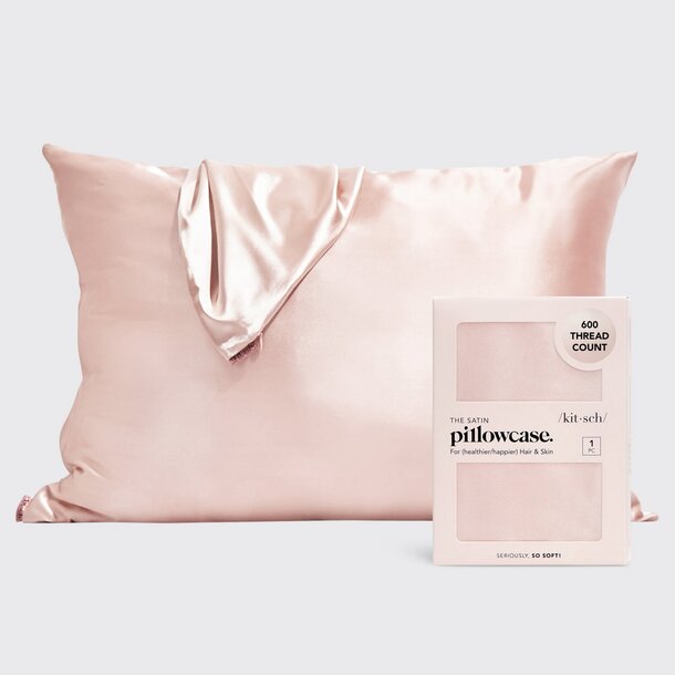 A satin pillowcase displayed alongside its elegant packaging box.