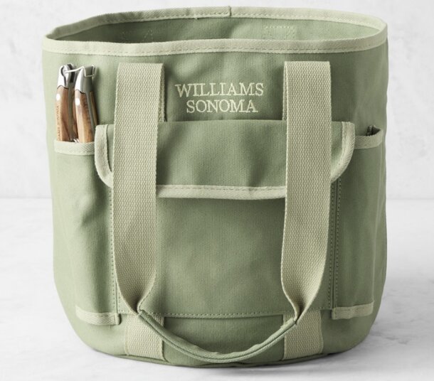 Personalized sage green tool bag with multiple pockets and a sturdy handle for easy carrying.
