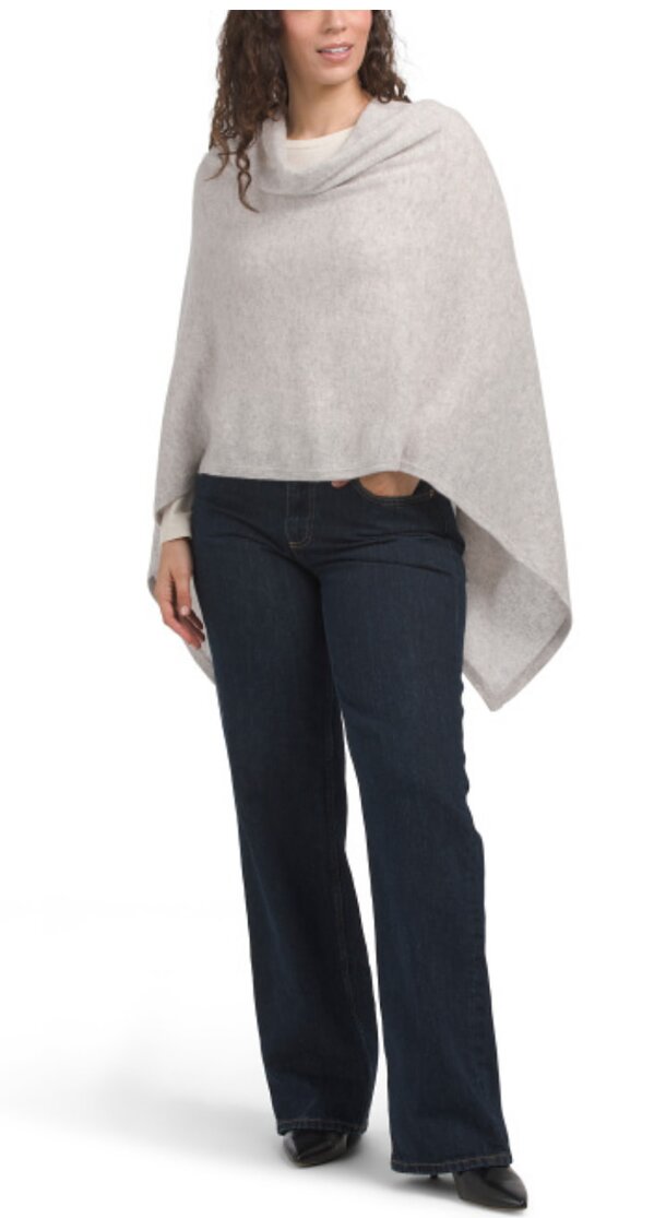 Elegant cashmere poncho with a long, draped neckline, designed for comfort and style.