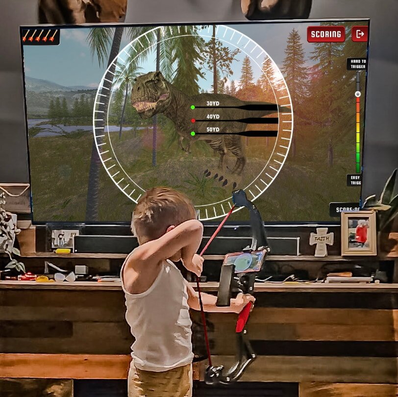 A young boy focused on playing a video game on a television screen, with a game controller in his hands.