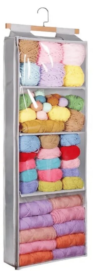 A skillet containing cooked potatoes topped with gooey cheese rests on a rustic table.