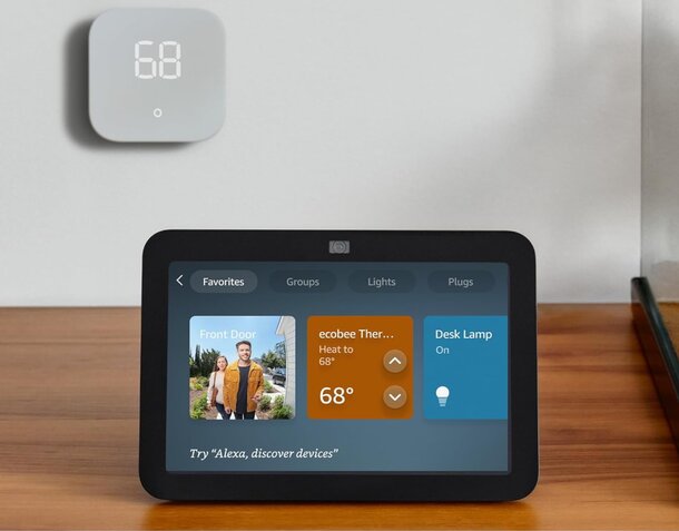 Smart Nest thermostat displayed, controllable via smartphone for efficient home temperature management.