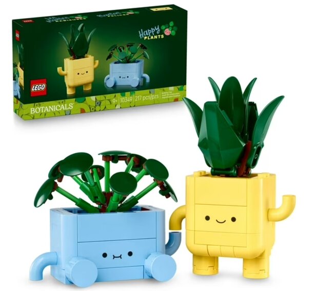 Two colorful LEGO plant pots, each containing a small green plant, displayed on a neutral background.