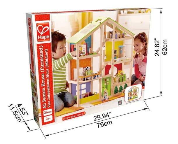 A wooden dollhouse with a child playing inside, engaging with miniature furniture and dolls.