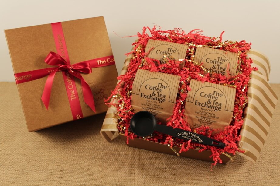 Gift box with red ribbon and coffee gift set